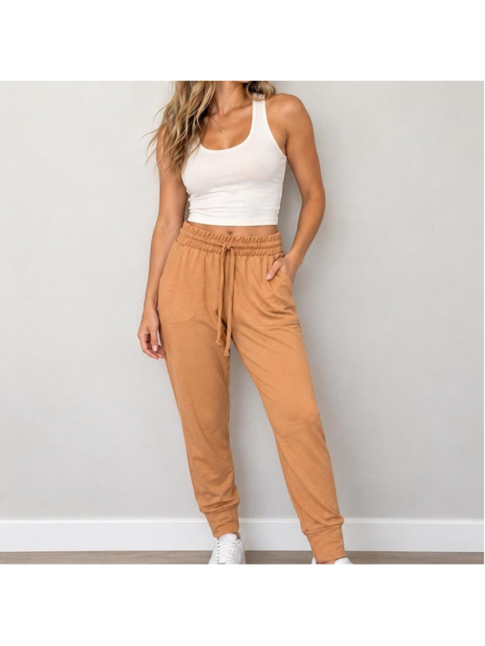 FP Movement Sunny Skinny Sweatpants in a soft peach/camel tone